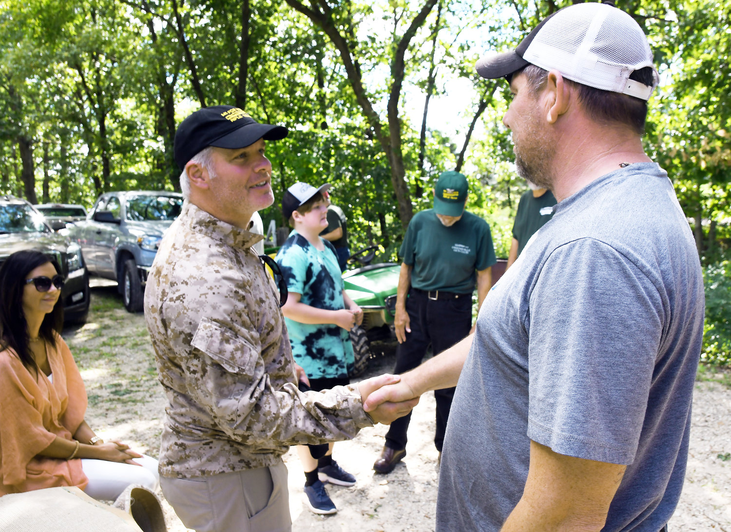 Rifle Team member Paul Schmitz (right) shakes hands with Gassoff following the CMP shooting match each participated in that day. Schmitz was a prior recipient of an M1 Garand from the project for wounds he received in Iraq.